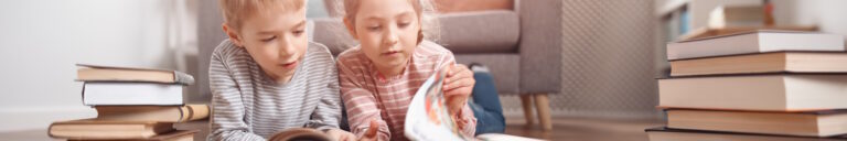 two kids reading together