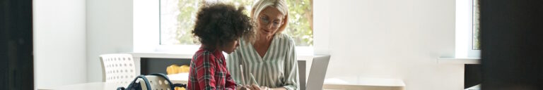 Female teacher helping student