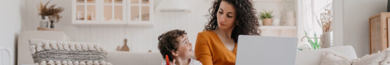 woman registering online with her young son